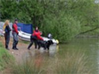 Picture of two judges conducting a leval A watertest