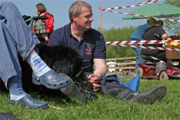Picture of man with black Newfoundland watching water tests