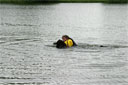 picture of brown newfoundland dog and owner on return section of right hand 'L' section of controlled swim